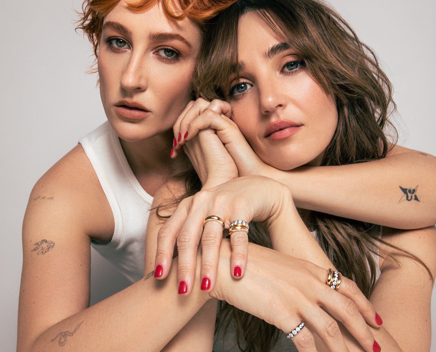 The fineman sisters Chloe and Emma modeling their new gold and diamond stacking bands.