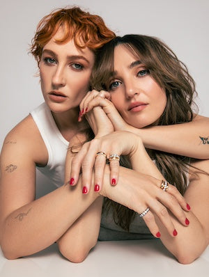 The fIneman sisters Chloe & Emma, modeling their latest designs new stacking bands. Diamond and Gold tapered thin adn thick bands made to stack or wear solo. Shop the fineman sisters new arrivals and entire collaborative collection.