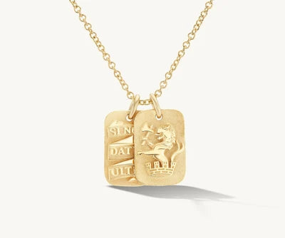 Gold chain necklace with two rectangular, engraved pendants featuring a lion and latin text.