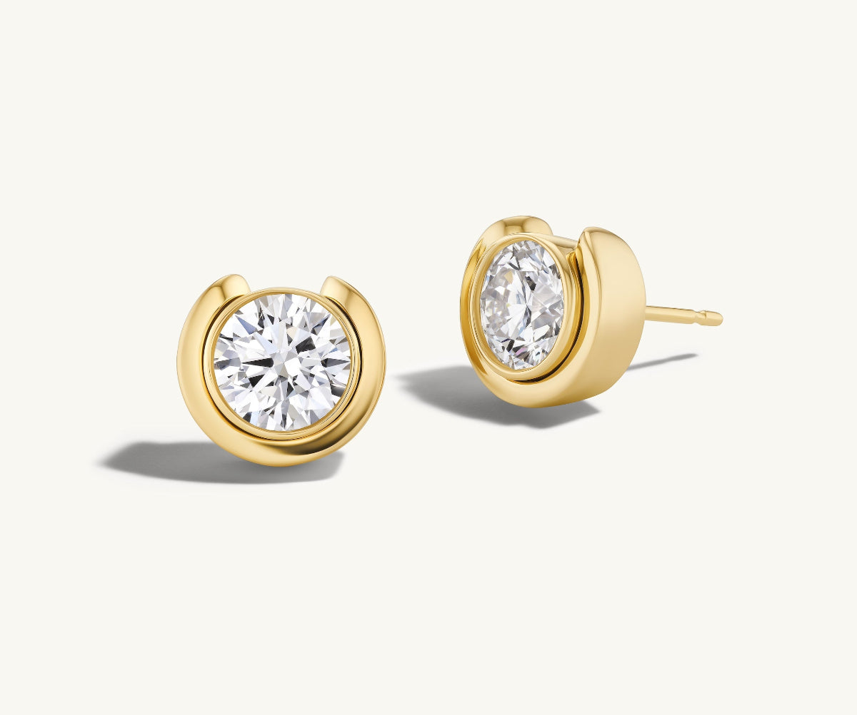 Large Timekeeper Studs in 14k yellow gold on a white background