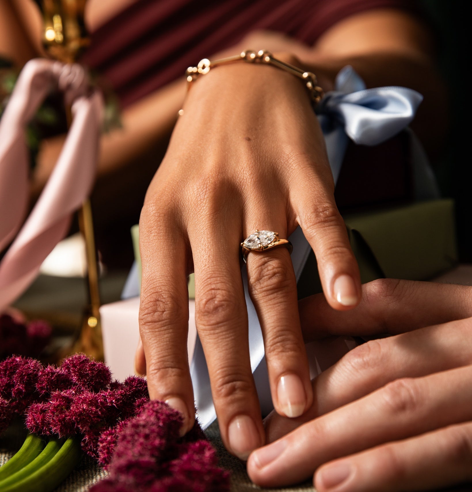 A model wearing a custom one of a kind diamond and gold ring designed by Sophie Ratner. Design your dream piece or reset an heirloom stone for this holidays. Designed by Sophie, customized for you.