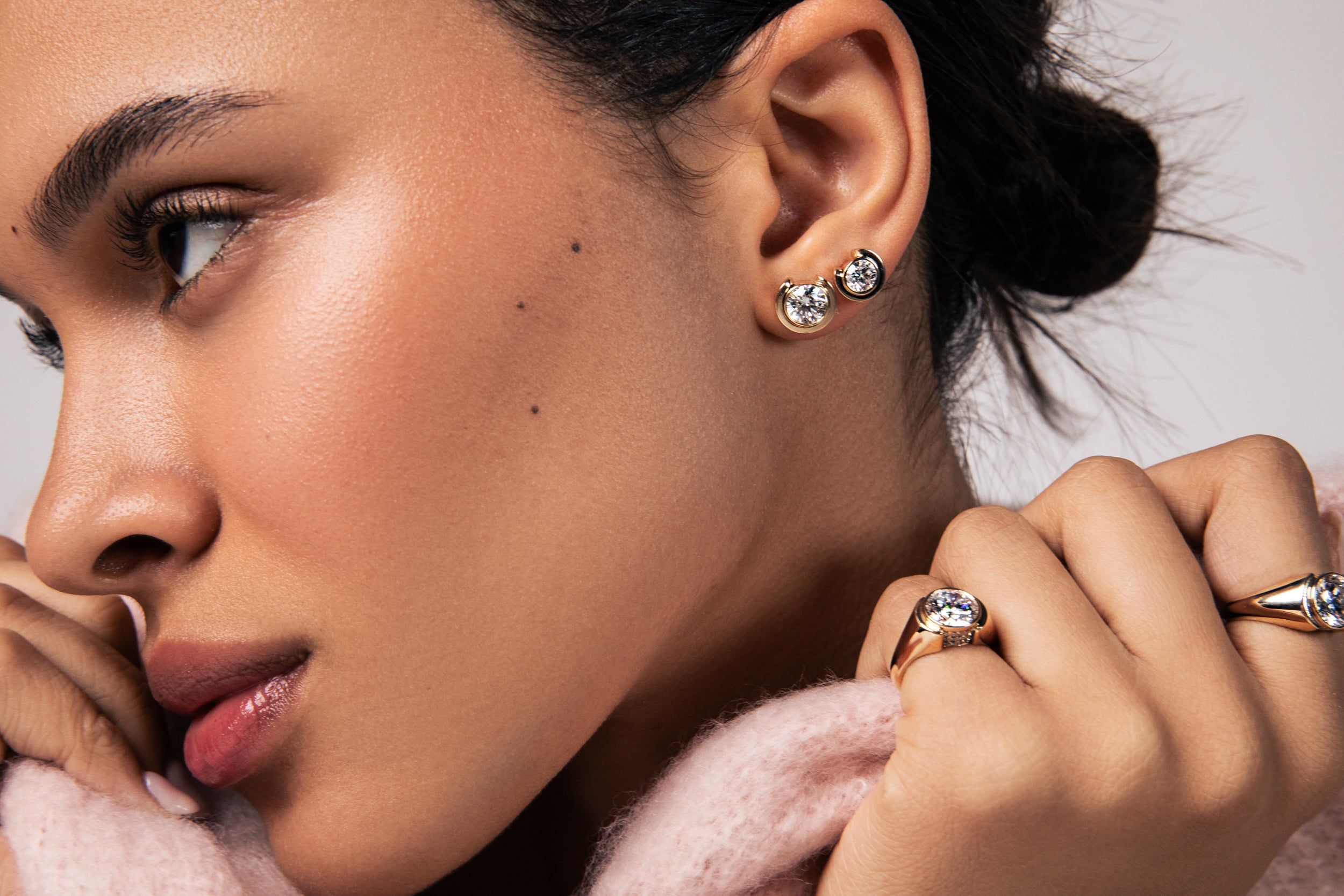 Close up of model Avony wearing the new diamond and gold bezel timekeeper collection for sophie ratner jewelry. Includes new studs, earrings, rings, pendants, bracelet and necklaces. Shop our the first new collection of 2026