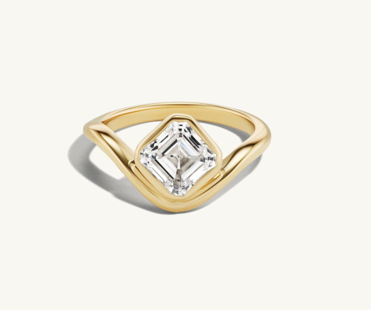 The Asscher Trace Ring on a white background in 14k yellow gold