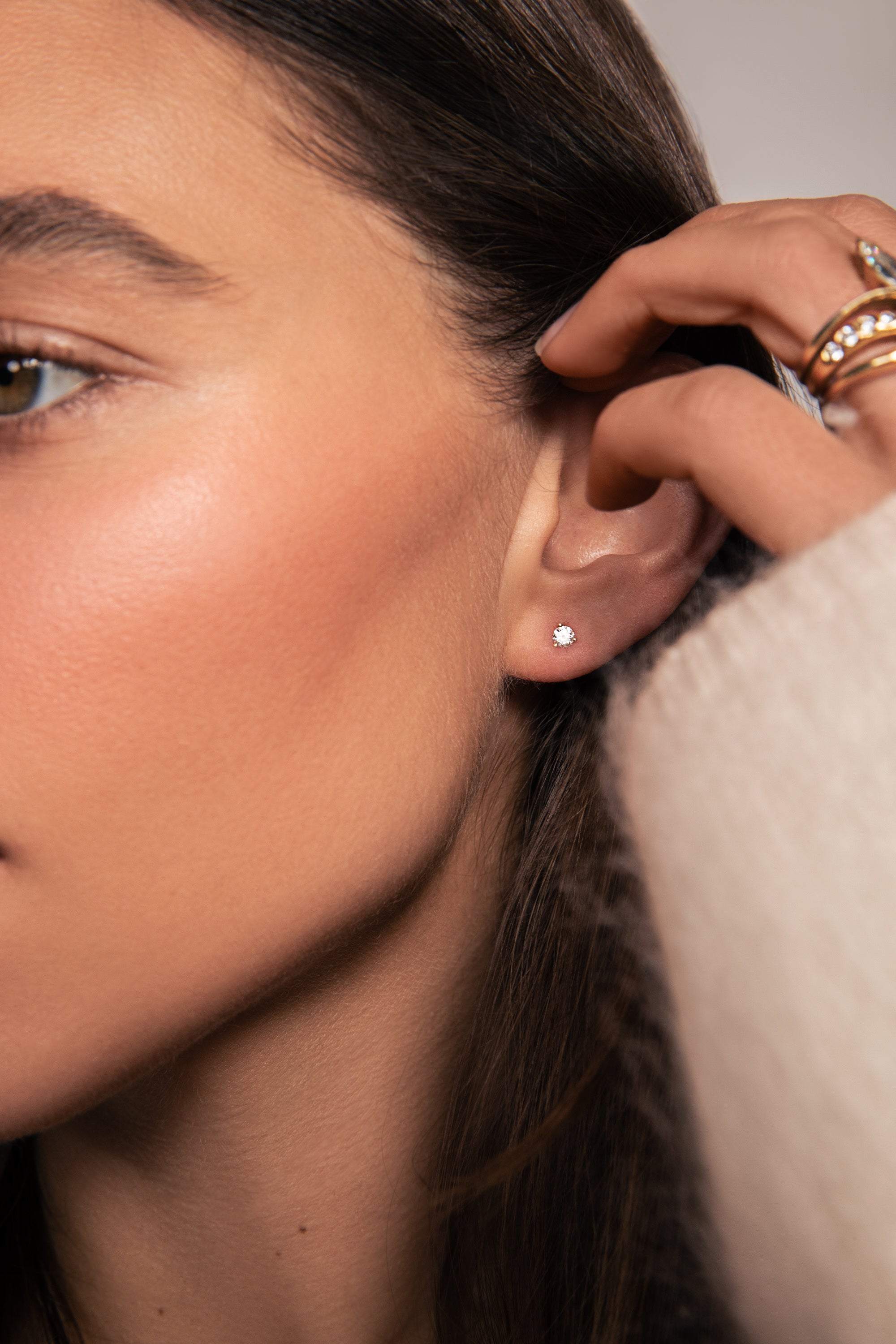 Close-up of Ella Rose McFadin wearing a free pair of lab grown diamonds studs. Get yours free with purchase with orders $850+, while supplies last. cannot be combined with other discounts or promotions.