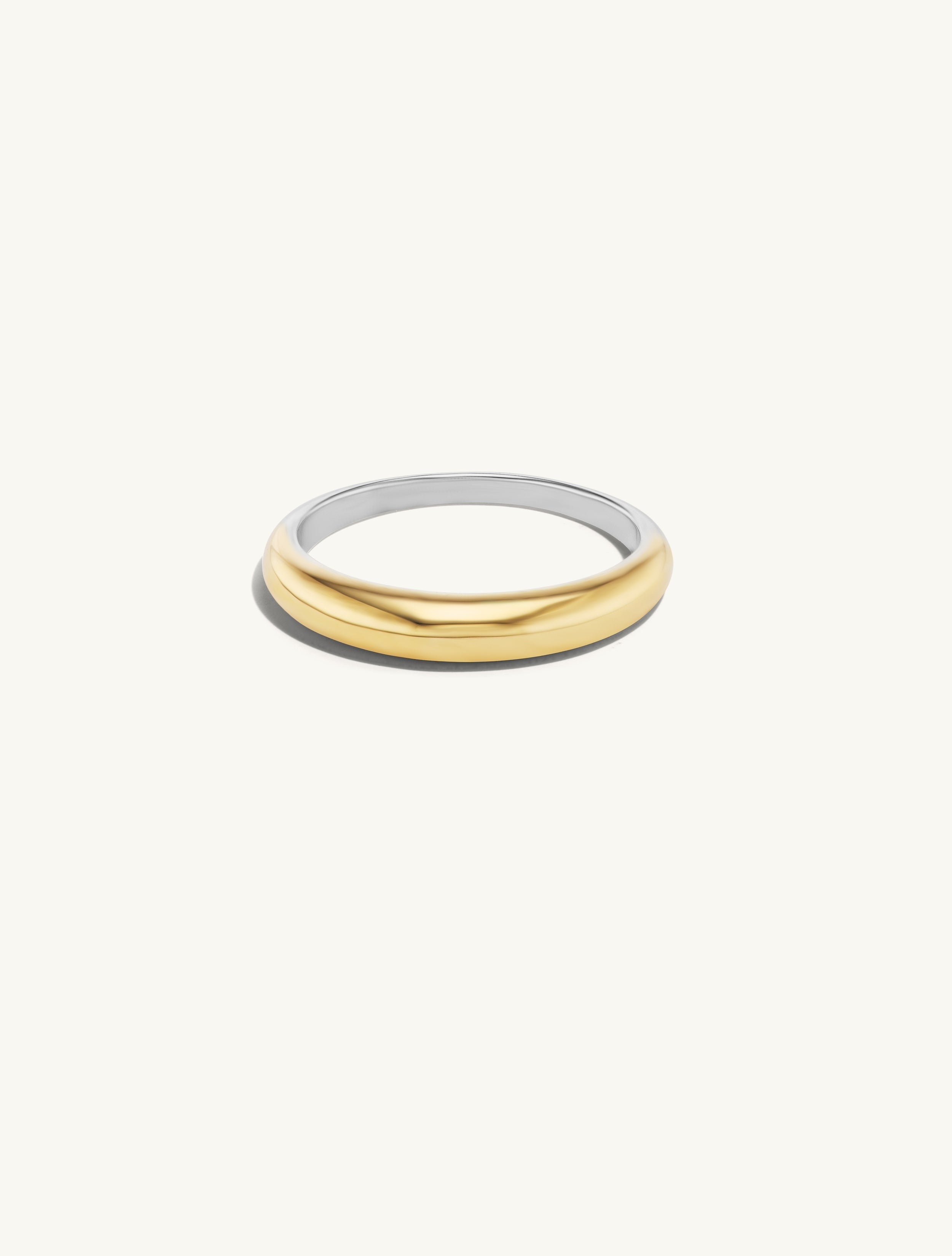 Thin Gold Tapered  Band. A Domed front of solid 14k gold with a sterling silver back. 