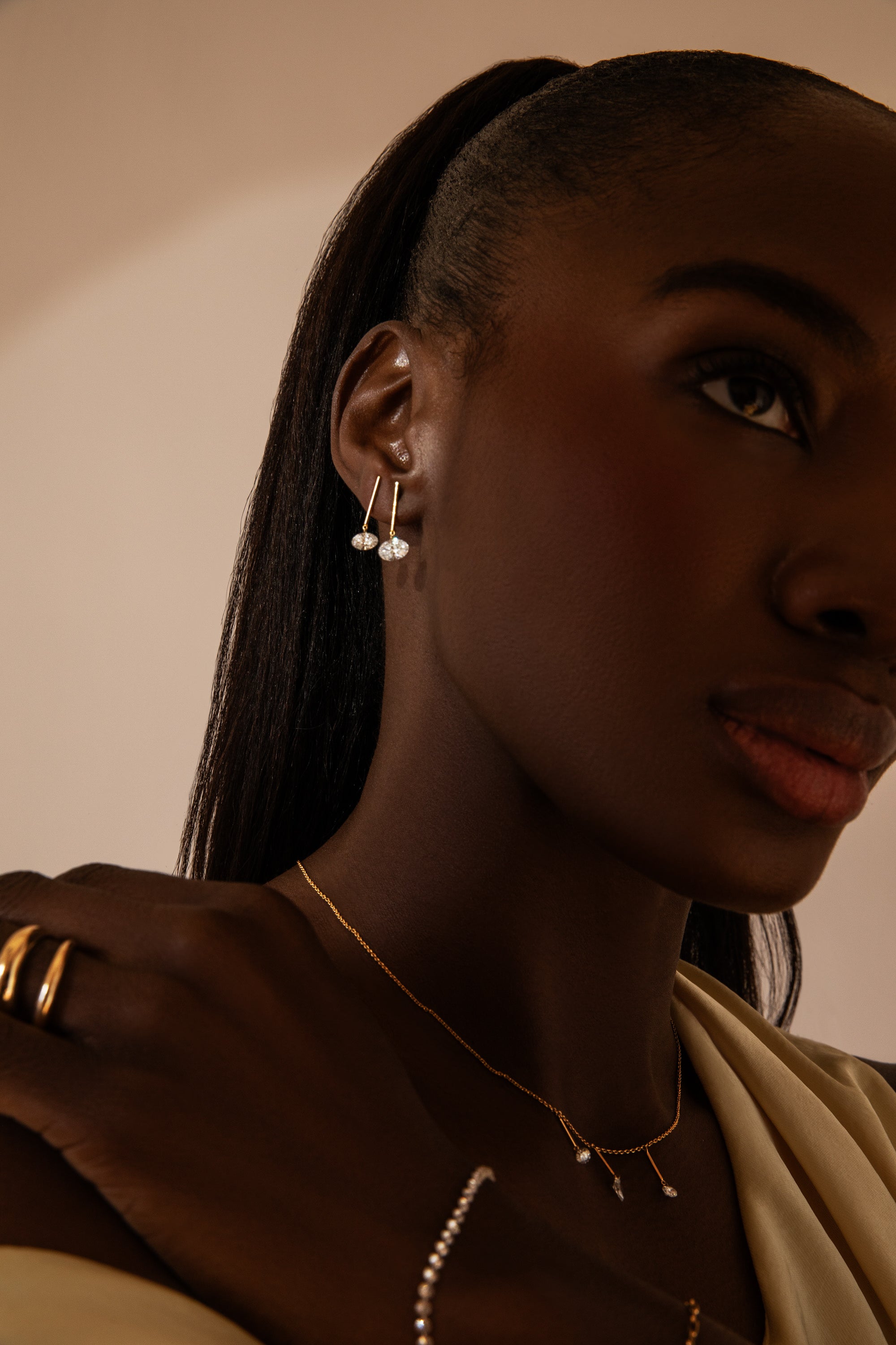 1/2 Carat Oval Pierced Diamond & Gold Bar Earring