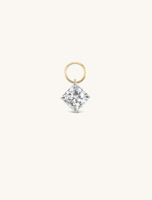 Diamond earring with gold setting on a white background
