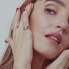 a video of chloe and emma fineman modeling their new gold and diamond stacking bands. Available in a thick and thin style with a gold or patina diamond design. 